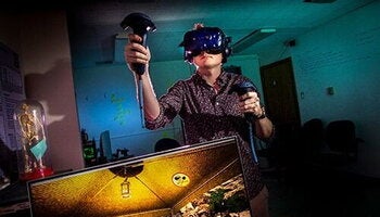 A grad student explores a virtual environment using VR