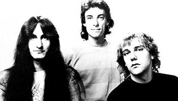 Photo of members of the band Rush from the 1970's. 