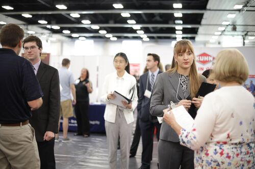 Students talk to recruiters at the ACES + LAS Career Fair