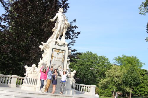 Students pose with a statue of Mozart in Vienna