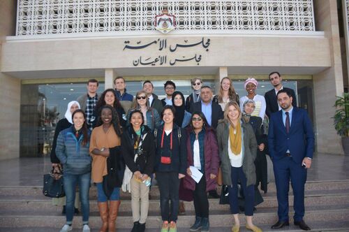 A group of students and faculty members on a study abroad trip to Jordan