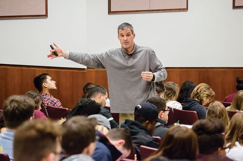 Communication professor Brian Quick lectures students