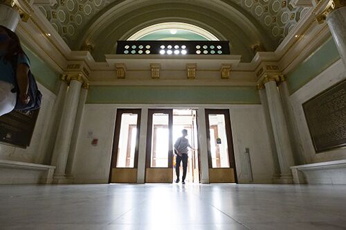 A student enters the Lincoln Hall lobby