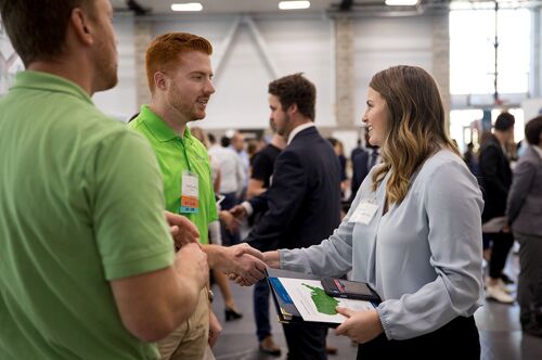 A student shakes hands at the LAS Career Fair