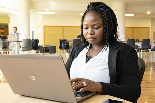 A student works on her computer