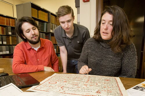 Students look at a map