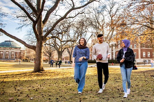 Students walk on the Quad