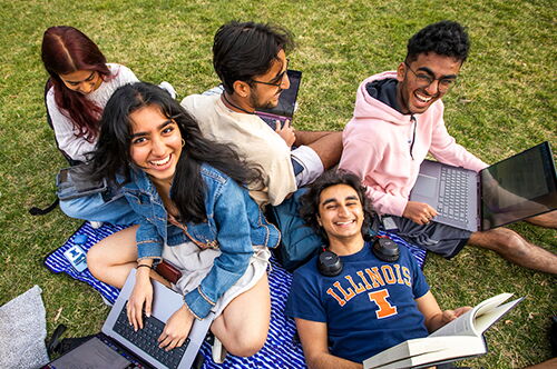 Students on computers on the Quad