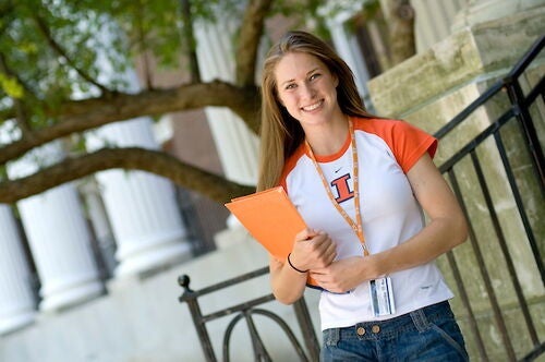 A student holding a folder