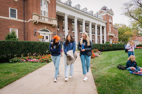 Students walk outside the English Building