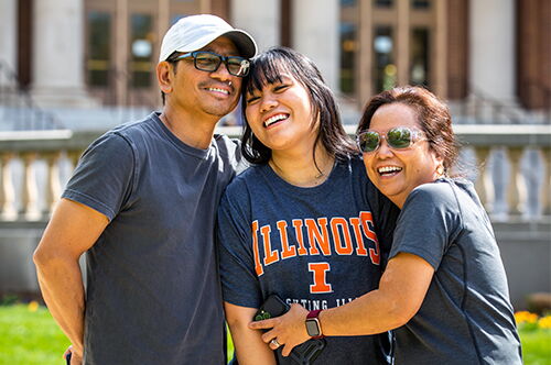 Parents and their child on the Quad