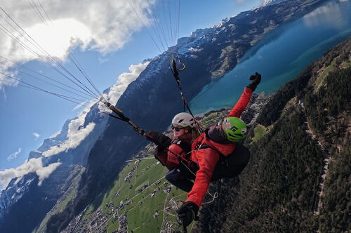 Study abroad students parasailing 