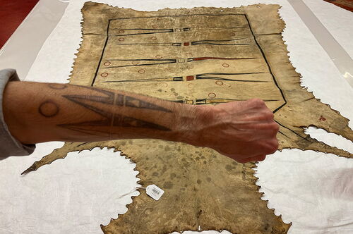 An arm tattoo based on patterns on an historic robe