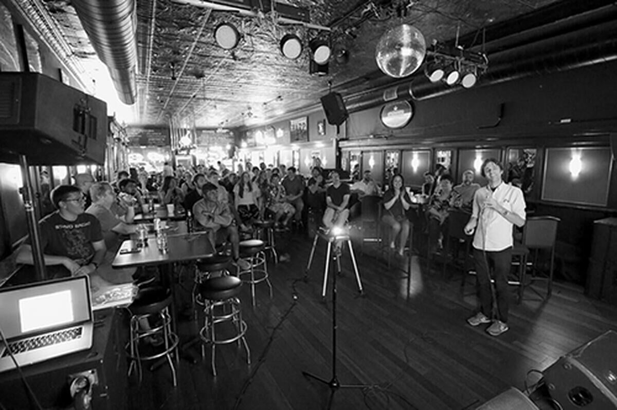 Bar patrons listen to an astronomy presentation