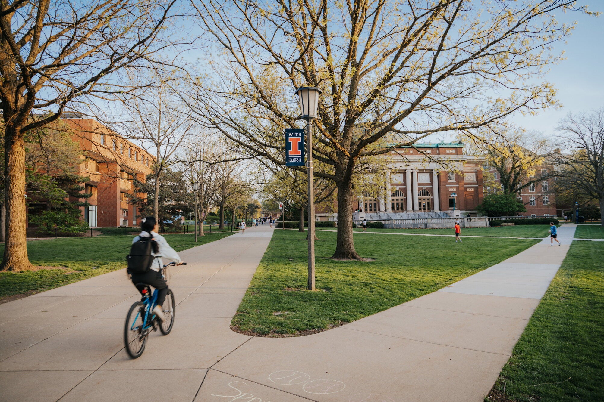riding a bike across the quad