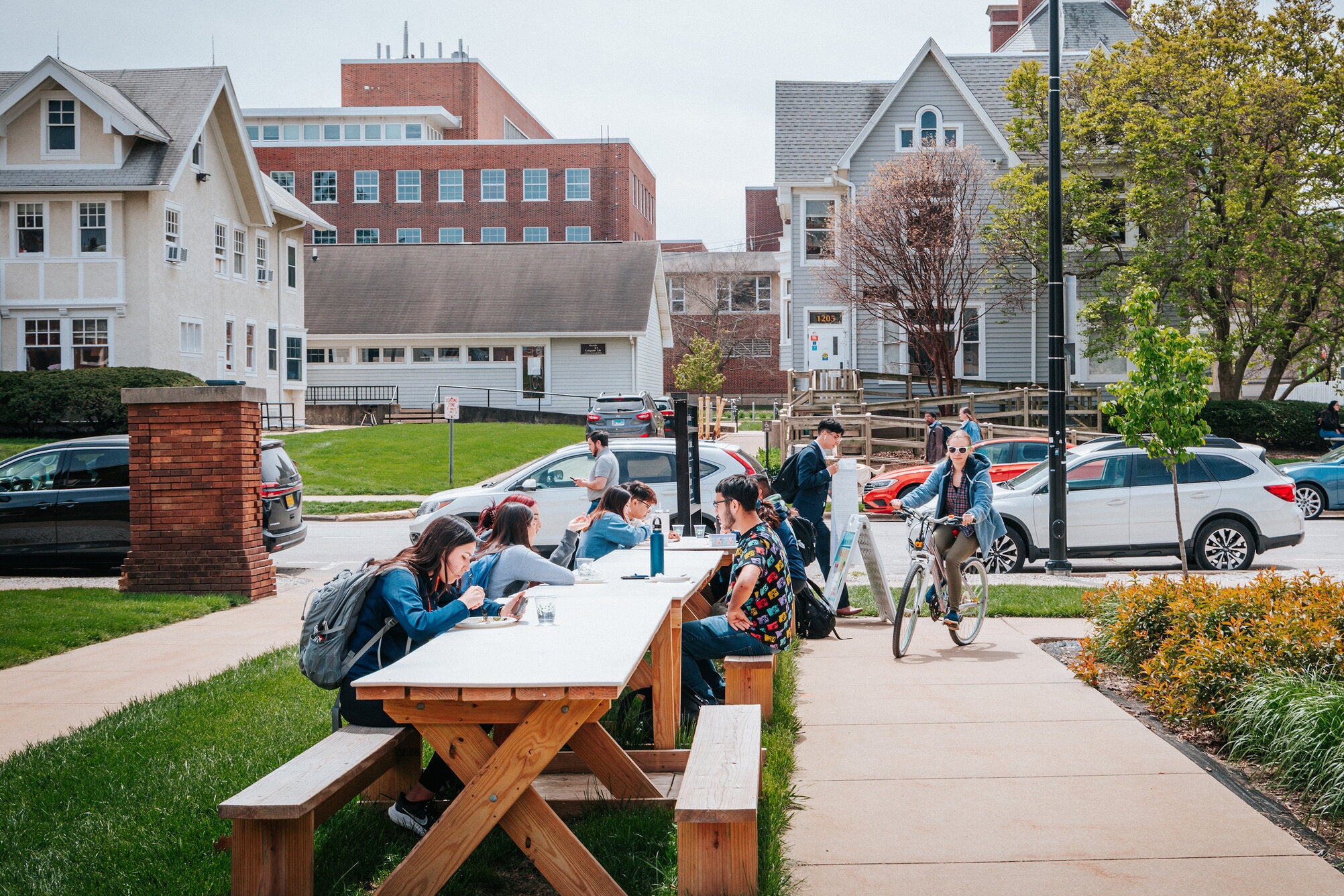 Students sit outside cultural houses at the University of Illinois