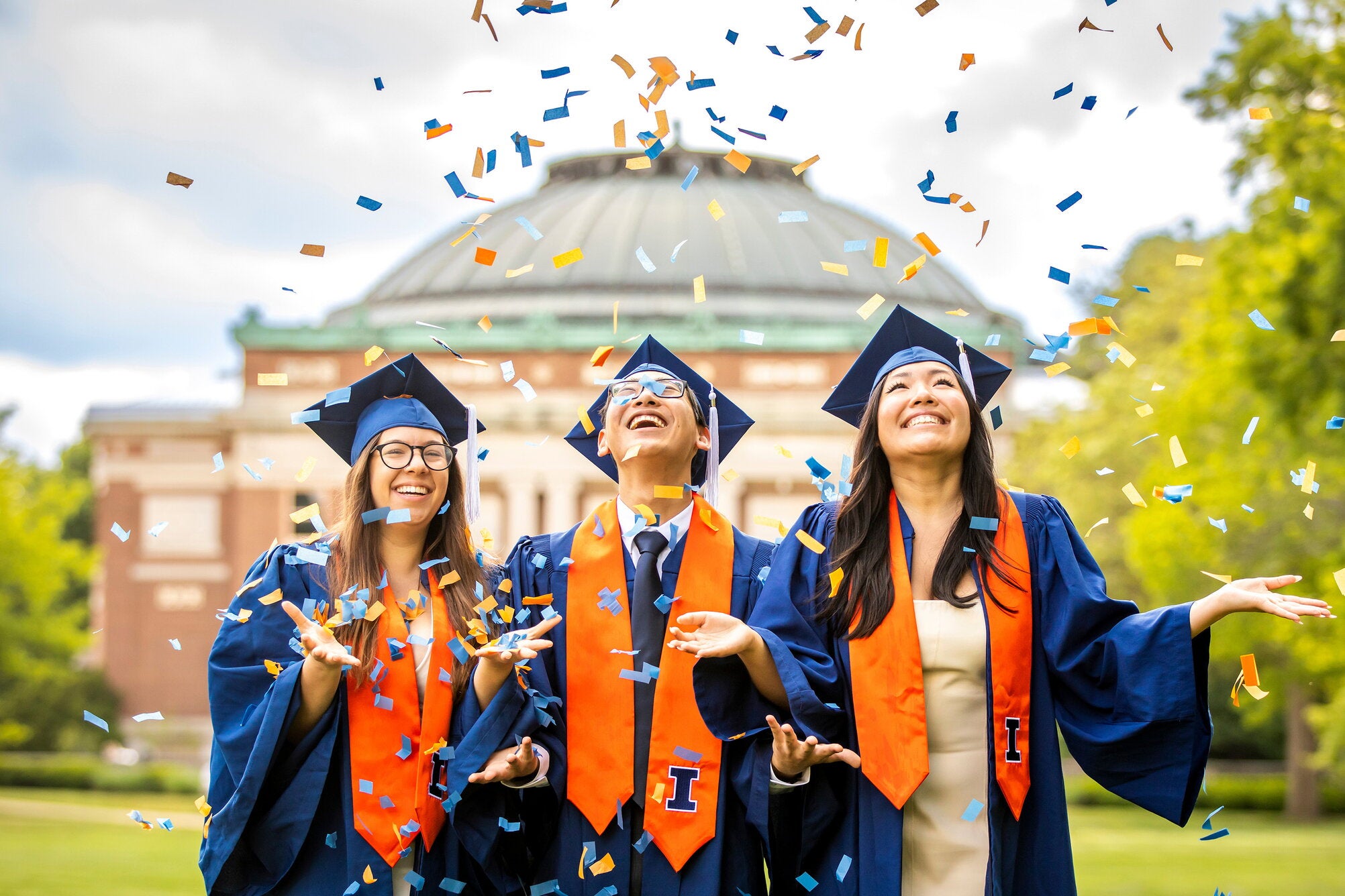 Graduates with confetti