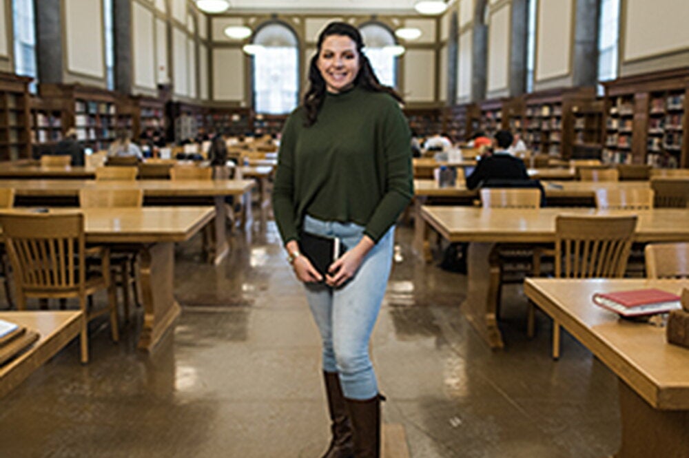 Edith Munoz poses in the Main Library at the University of Illinois