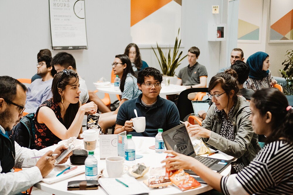 Students at iVenture discuss their startup