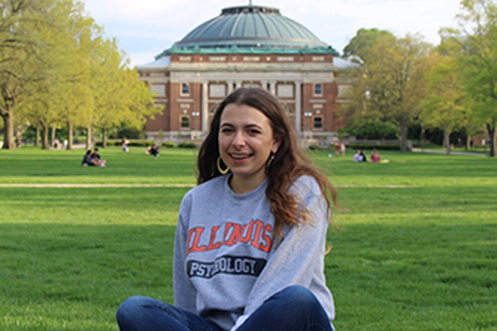 Elena sits on the Main Quad