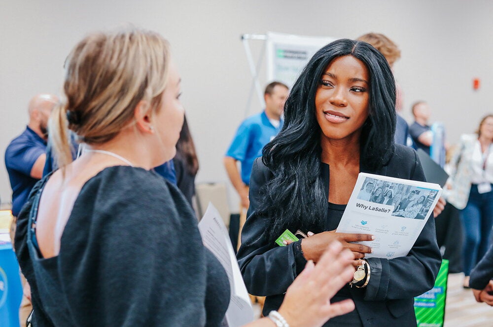 a student talks to a recruiter at the LAS Career Fair