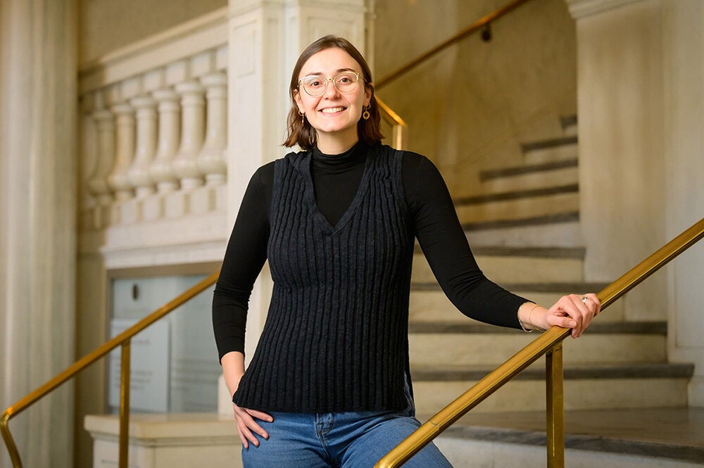 Christina Kamis stands in a stairwell