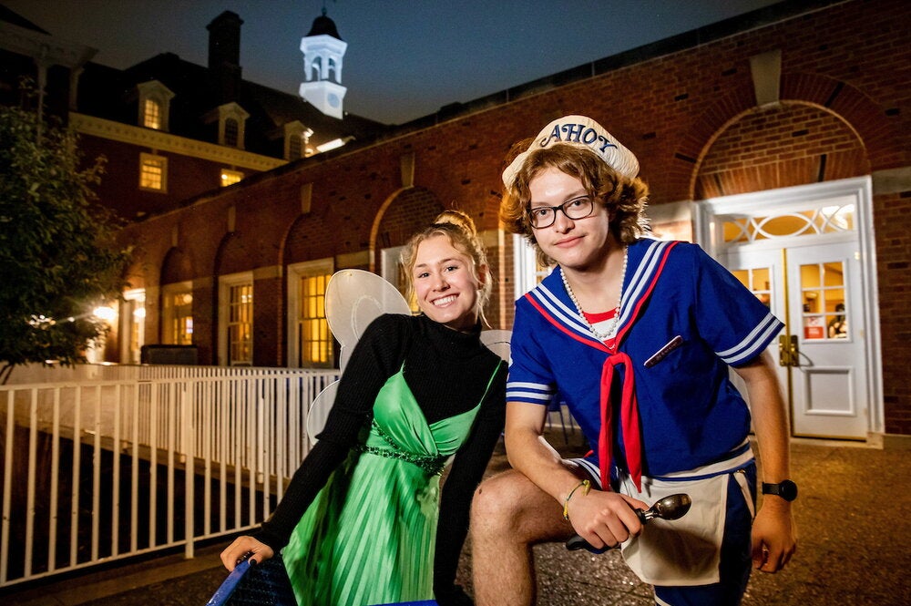 Two students in Halloween costumes at the Illini Union. 