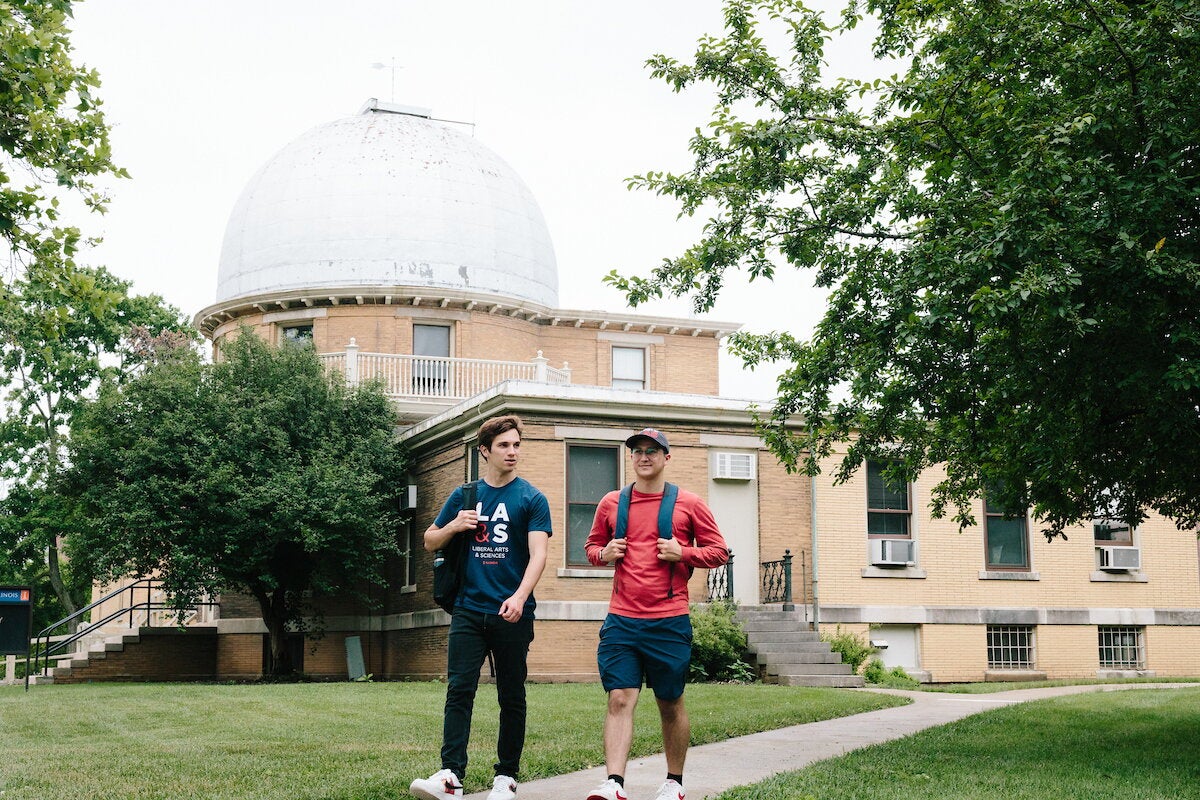 Students walk past the observatory