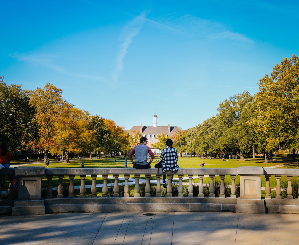Two students with their backs to Foellinger, facing the Union side of the Quad