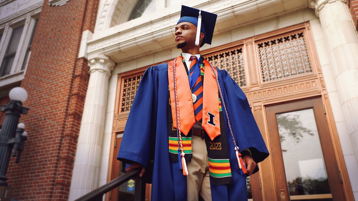 student poses in front of Lincoln Hall