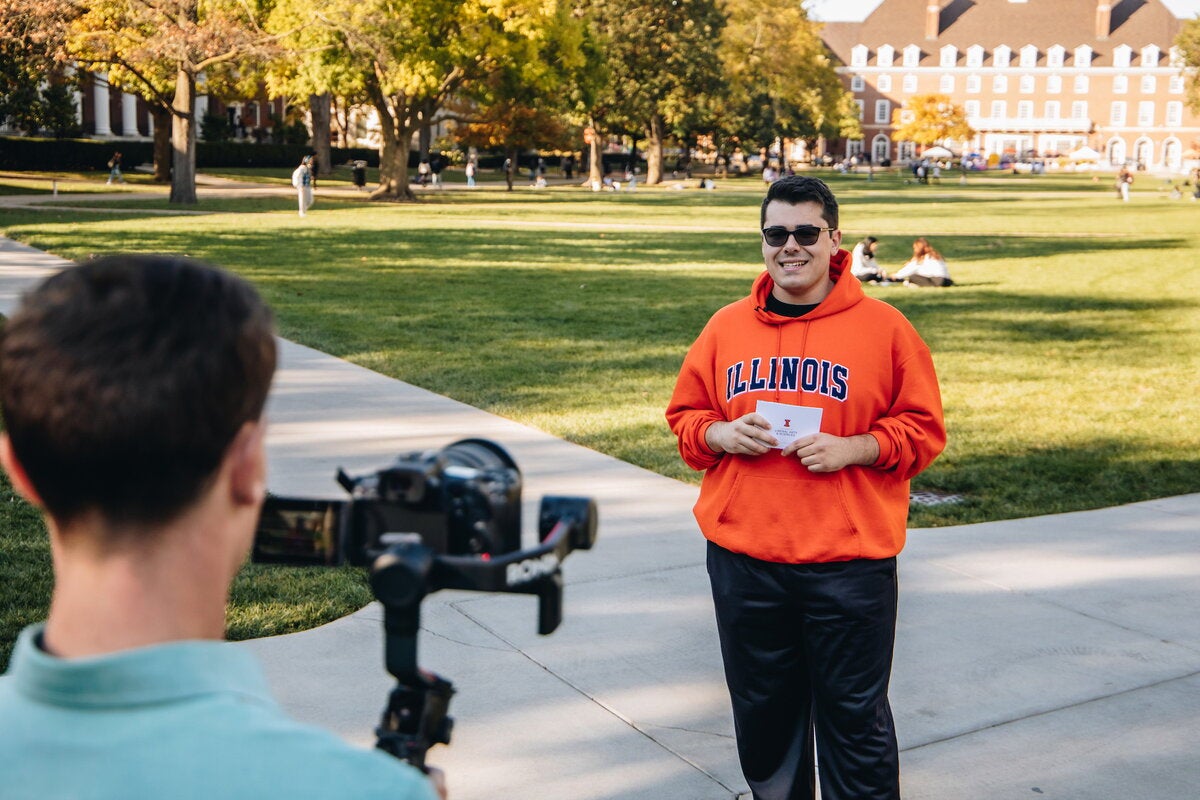 A student being interviewed on the Main Quad