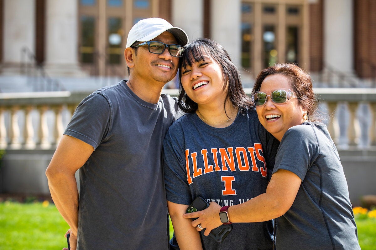Parents and their child on the Quad