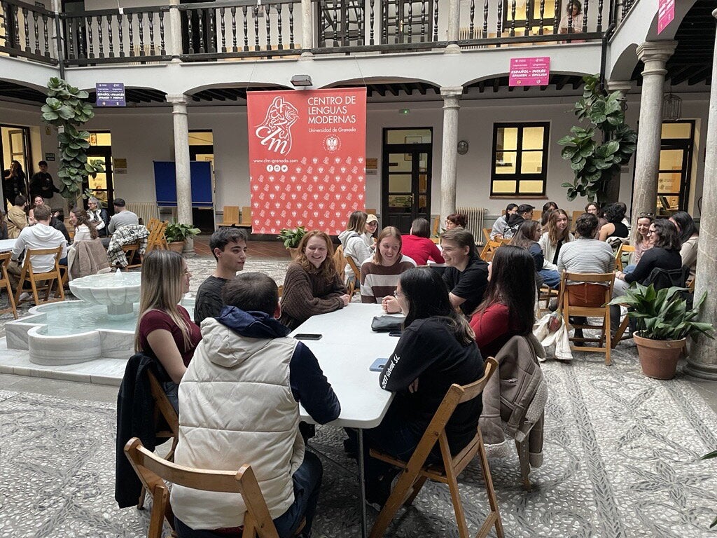 Students in Granada engaging in a conversation. 