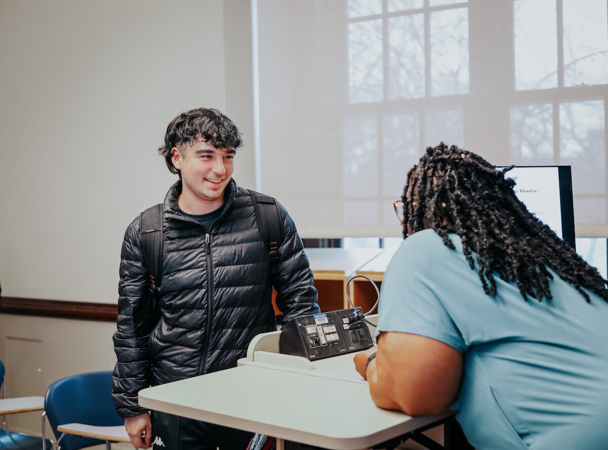 Student speaking to professor 