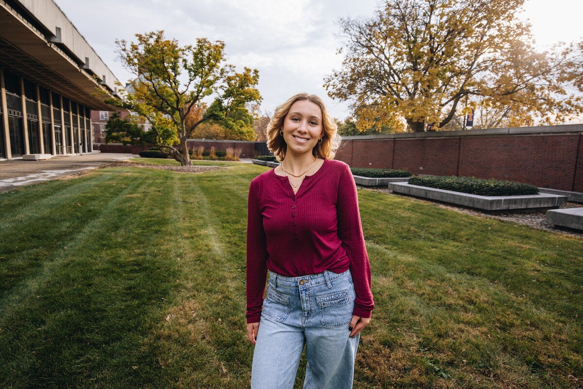 Lincoln scholar posing on campus on a fall day. 