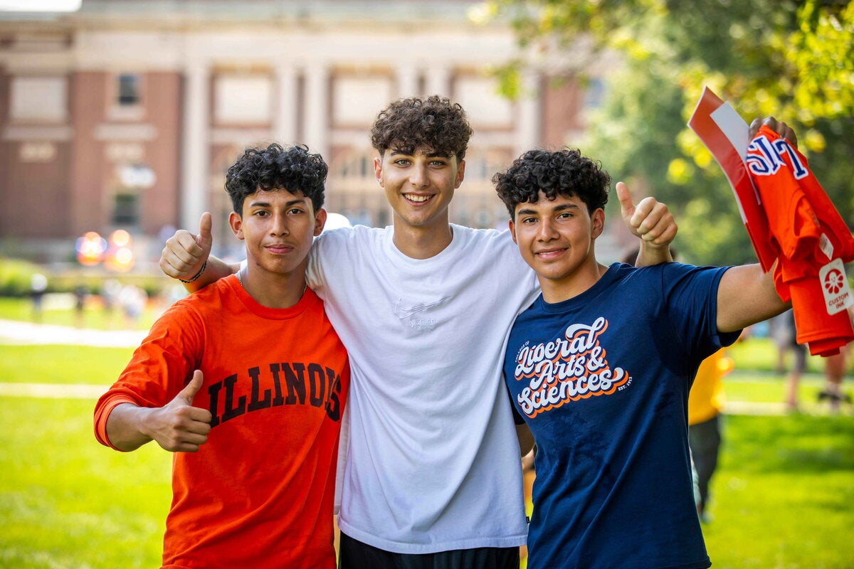 students pose together on the quad