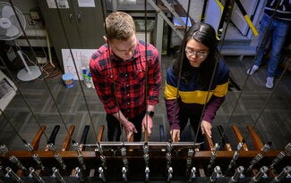 Members of the Altgeld Ringers from past and present gather to play the chimes during a Sunday morning recording session. The players hope the recordings will help carry the Illini tradition of the chimes until the building is restored. 