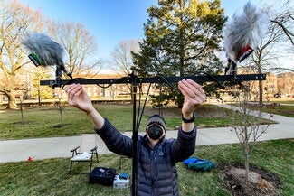 Members of the Altgeld Ringers from past and present gather to play the chimes during a Sunday morning recording session. The players hope the recordings will help carry the Illini tradition of the chimes until the building is restored. 