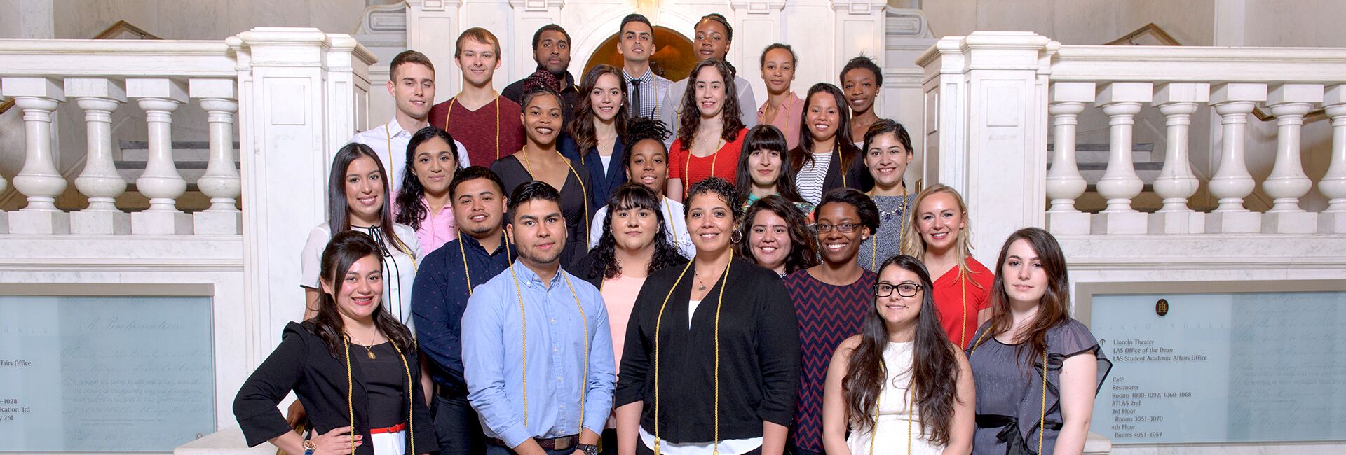 AAP graduates pose in Lincoln Hall with their graduation cords