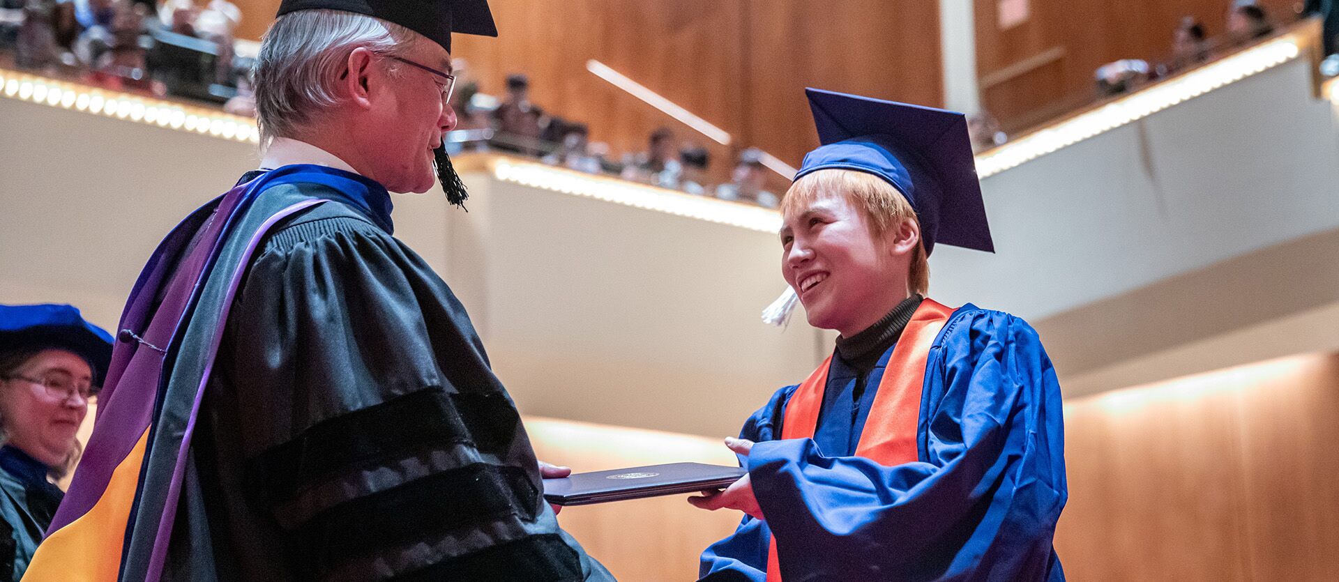LAS graduate receives diploma.
