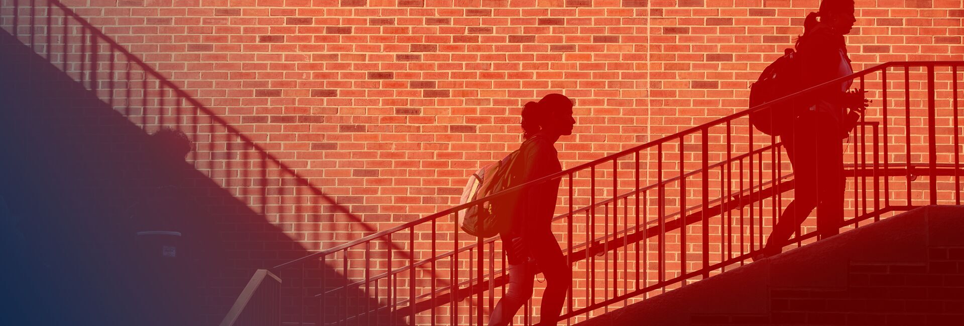 Students climb stairs outside the Psychology Building