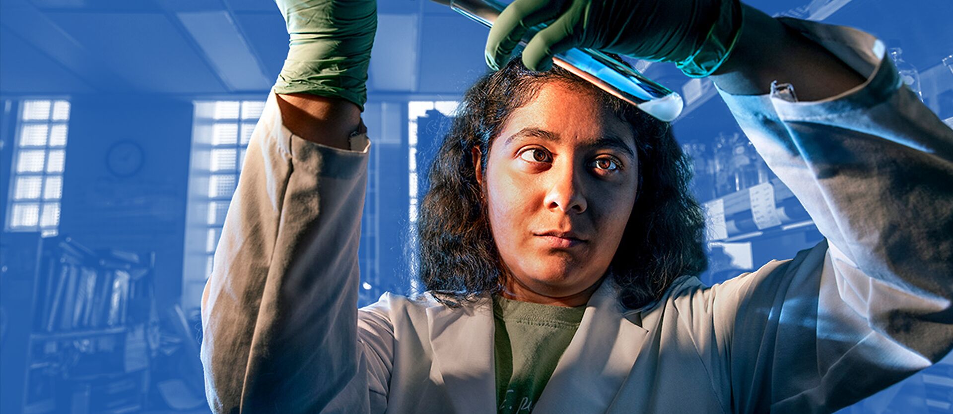 A student examines a test tube