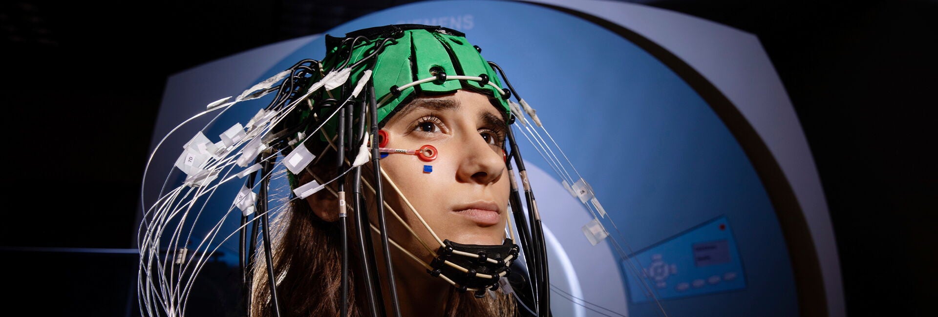 A student hooked up to an EEG