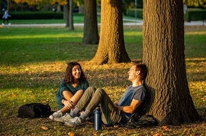 people outside in sunset