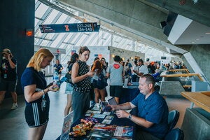 German department table at LAS Liftoff in the hallway of State Farm Center