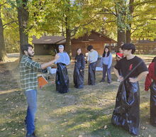 GLP members in a wooded area on a Fall day participating in a sack race