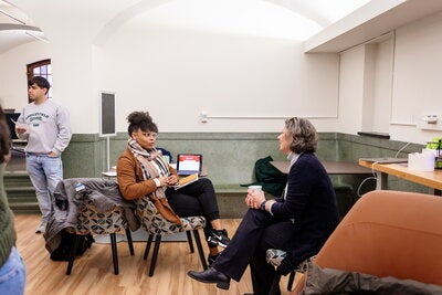 Two people speaking in the Lisnek Hub