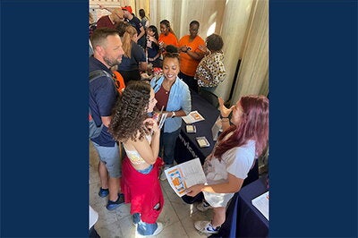 Colette Roth, right, speaks to students