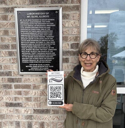 Helaine Silverman in front of historical plaque