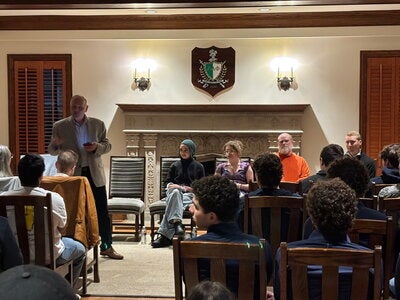 award ceremony in the Alpha Delta Phi house